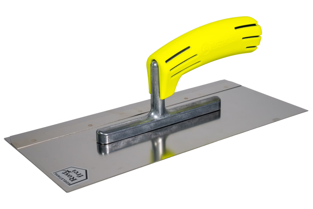 A close-up photo of a rectangular stainless-steel finishing trowel with a bright yellow ergonomic plastic handle. The handle is mounted on a short metal stem and features ventilation slots and an embossed brand name; the polished steel blade reflects the handle and shows faint work marks. The tool is used for smoothing plaster, cement or levelling compounds and is shown isolated on a white background.