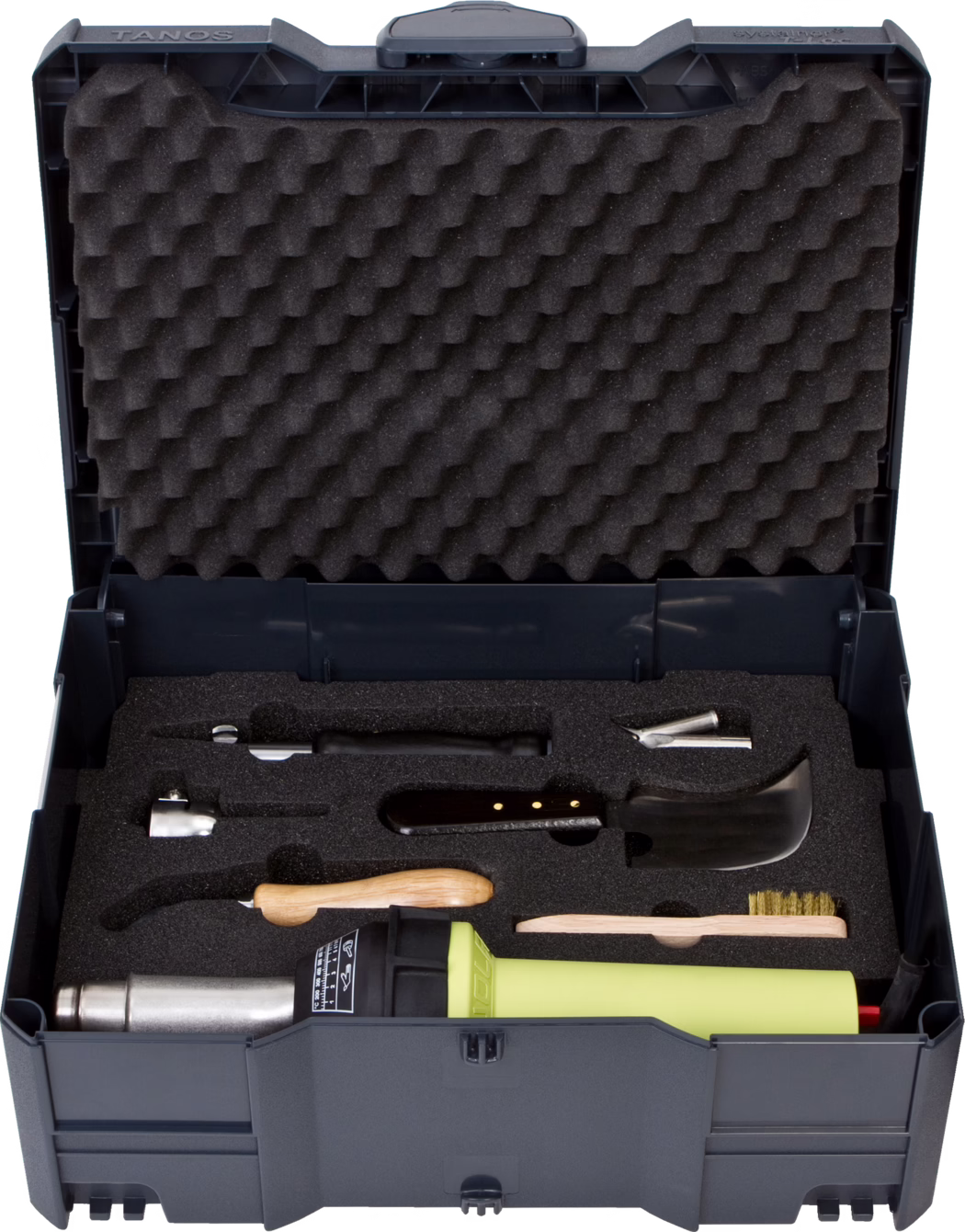 Open dark grey plastic tool case with egg-crate foam in the lid and a black custom foam insert holding a lime-green heat gun, wooden-handled scrapers, metal nozzles, a small wire brush and other accessories arranged in cutouts.