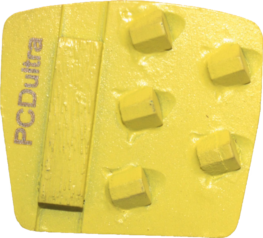 A yellow, square-shaped diamond grinding segment used for floor preparation. The metal or resin-bonded pad features six raised, square diamond buttons on the right side and a long rectangular mounting or wear bar on the left. The surface is painted bright yellow with a slightly rough texture and shows minor signs of use; the left edge is vertically stamped with the text 'PCDultra'. The segment appears designed to attach to a grinder or backing plate and is intended for aggressive material removal on concrete or stone.